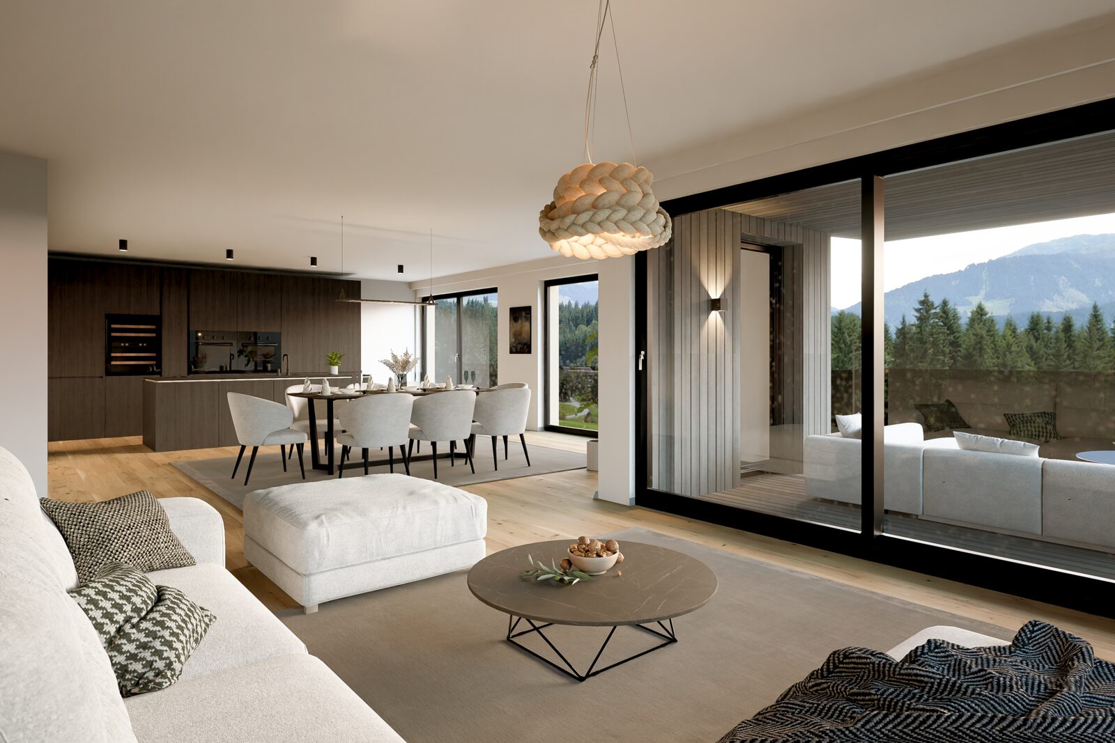 Wohnung W4 – offener Wohnbereich mit Bergblick und Eichenparkett